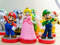 Nintendo amiibo toys of characters Mario, Luigi, and Peach