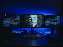 Hacked computer with Guy Fawkes mask