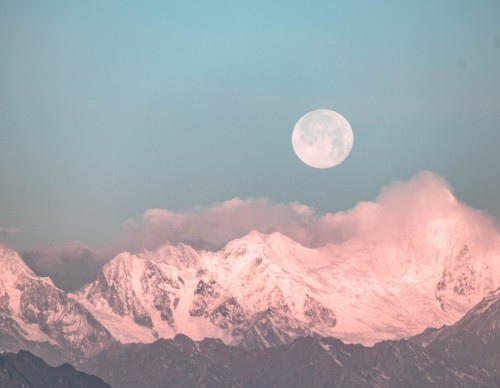 full moon atop mountain