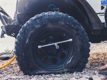 flat tire with lug wrench