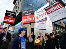 Writers on strike march