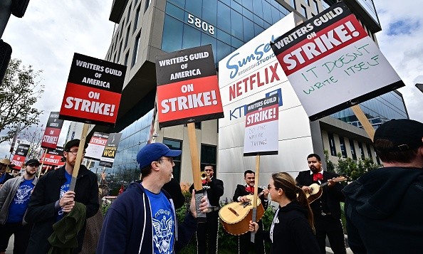 Writers on strike march