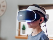 Boy Wearing Black and White Virtual Reality Headset