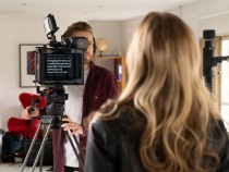 Filming presenter using teleprompter