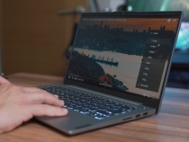 black and silver laptop computer on brown wooden table