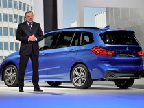 BMW CEO with the company's BMW 2 Series