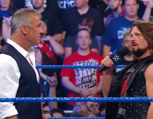 Shane McMahon & AJ Styles shake hands before the 