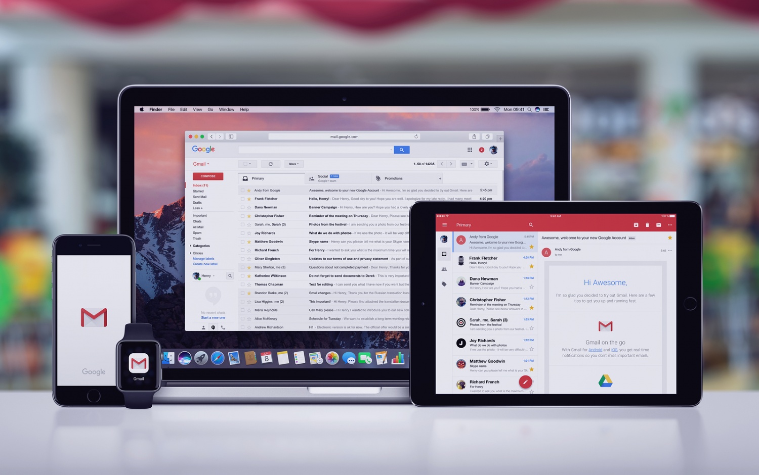 Google Gmail page on the Apple MacBook Pro, Gmail app on iPad Pro, Gmail splash screen with logo on iPhone 7 and notification icon on Apple Watch. Office desk concept.