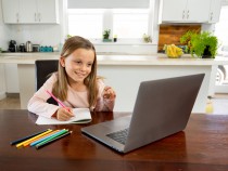 Schoolgirl watching online education class