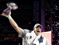 FILE PHOTO: New England Patriots tight end Rob Gronkowski holds up the Vince Lombardi Trophy after his team defeated the Seattle Seahawks in the NFL Super Bowl XLIX football game in Glendale