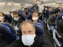 Dr. Weiss aboard a filled 737 flight from New York to San Francisco
