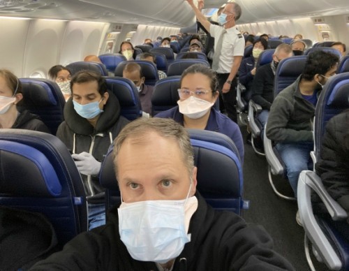 Dr. Weiss aboard a filled 737 flight from New York to San Francisco