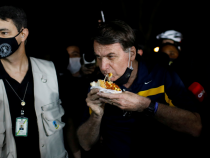 [VIDEO] Moment Brazil President was Jeered at and Called a 'Murder' as He Walked Up to Eat Hotdog Outside His Residence
