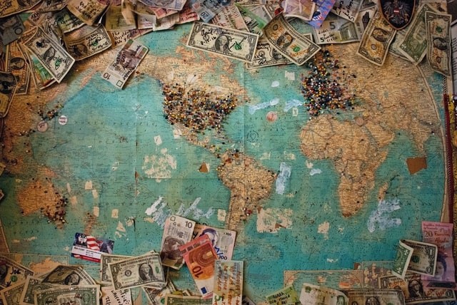 Map of the world with different currencies on it