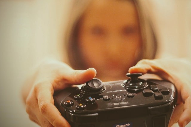 Woman with a video game controller